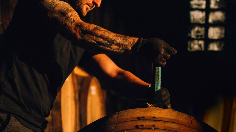 ardray artist man with barrel